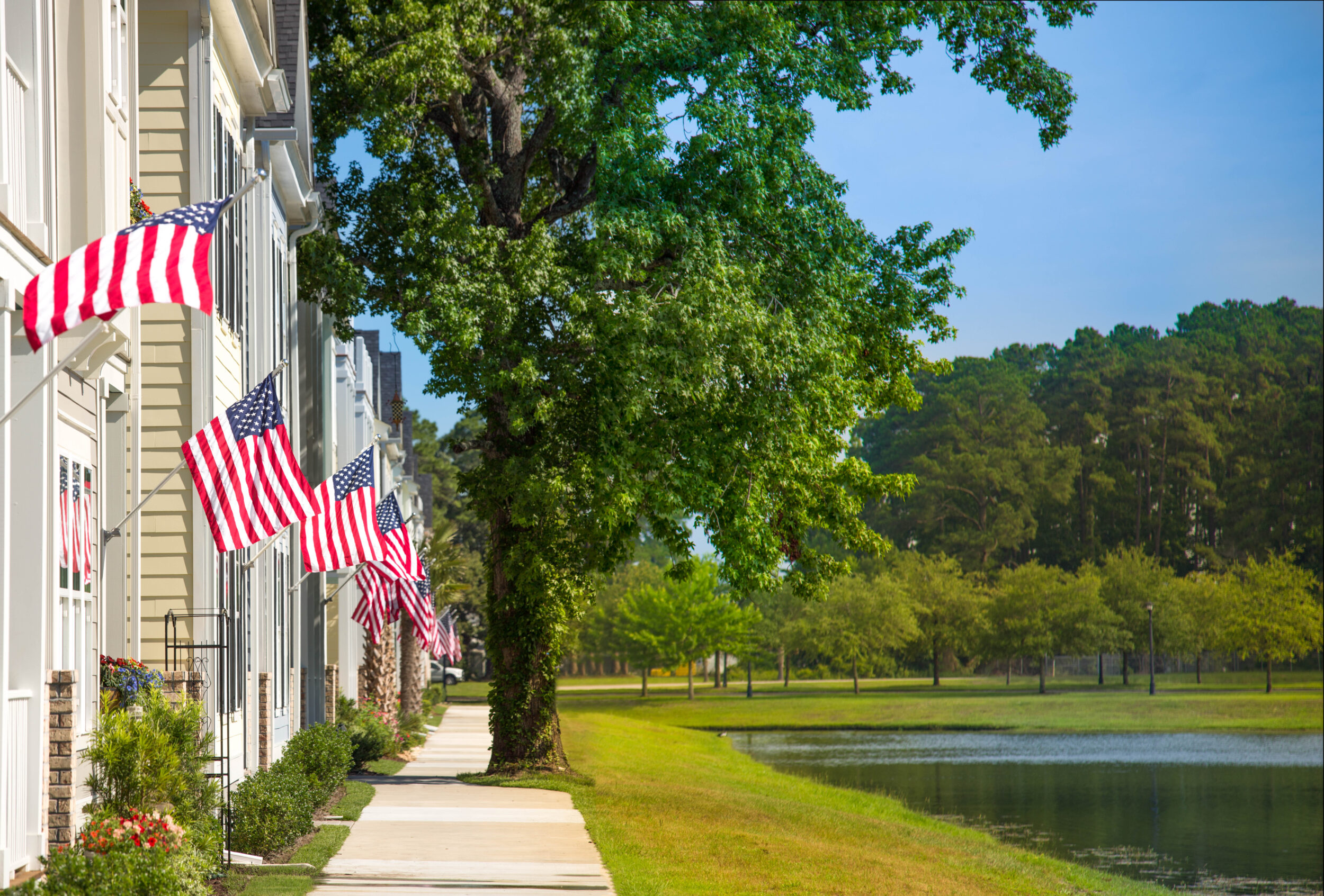 A view of townhomes in Market Common with the American Flags proudly waving.