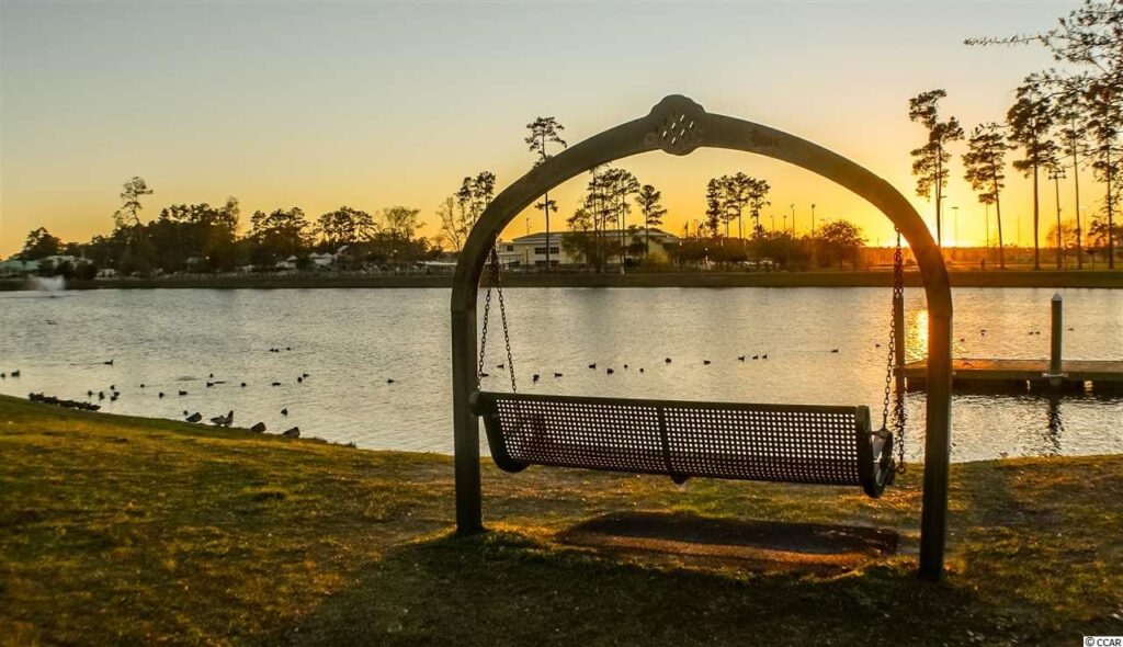 Breathtaking view of the lake in Market Common and one of the many benches that surrounds it.